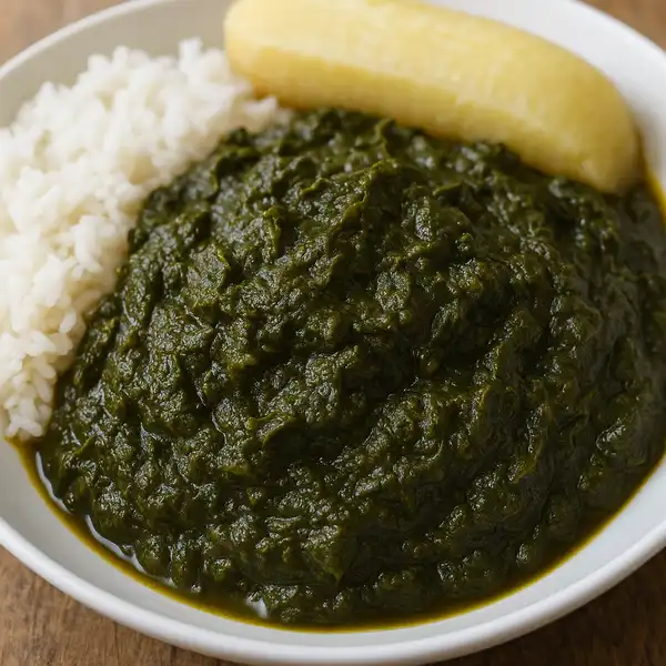 A bowl of Saka-Saka, a traditional Congolese cassava leaf stew.