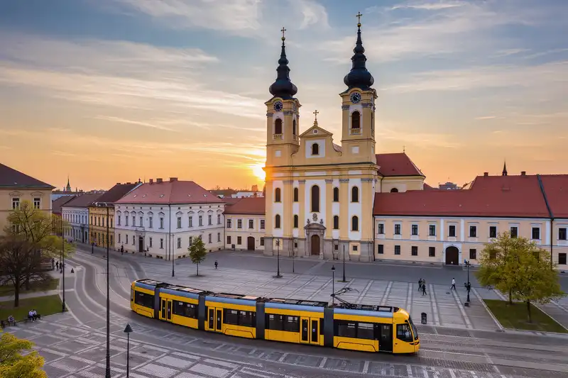 Debrecen Great Church and tram at sunset