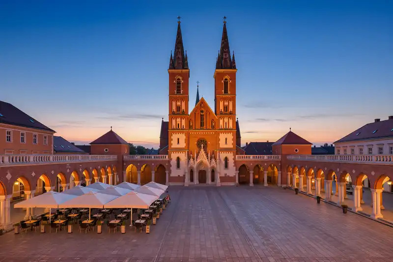 Szeged cathedral square and arcades at dusk